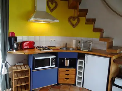 Cuisine ou kitchenette dans l'établissement La Tour du Moulin Géant