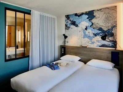Un ou plusieurs lits dans un hébergement de l'établissement ibis Styles Saint Nazaire Centre Gare