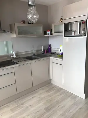 Cuisine ou kitchenette dans l'établissement Appartement ST JEAN Centre Ville Wifi Balcon Parking
