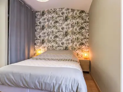 Un ou plusieurs lits dans un hébergement de l'établissement Gîte cosy à Vertou, près de Nantes, avec Wi-Fi et espace extérieur - FR-1-306-1217