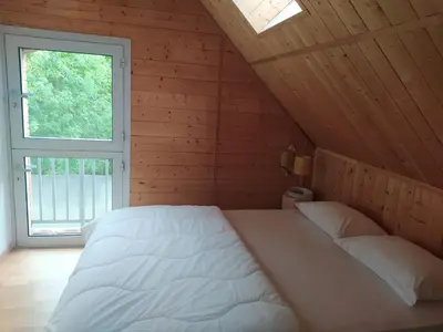 Un ou plusieurs lits dans un hébergement de l'établissement Gîte La Pironnière - Piscine, Nature, au bord de la Rivière