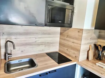 Cuisine ou kitchenette dans l'établissement L'Ebenisterie - Sublime Type 2 Lumineux - Grand balcon