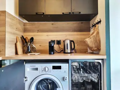 Cuisine ou kitchenette dans l'établissement L'Ebenisterie - Sublime Type 2 Lumineux - Grand balcon