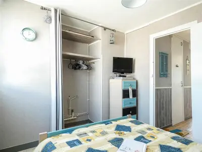 Un ou plusieurs lits dans un hébergement de l'établissement Appartement 3 chambres avec grand balcon et garage proche du casino - FR-1-323-260
