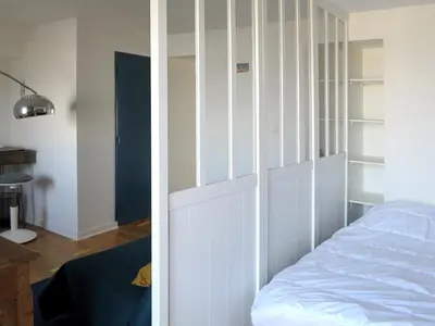 Un ou plusieurs lits dans un hébergement de l'établissement Bel appartement avec vue directe sur loire