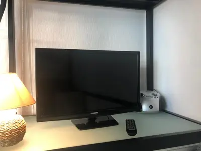 Télévision ou salle de divertissement dans l'établissement Le ROS ÉDEN