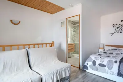 Un ou plusieurs lits dans un hébergement de l'établissement Maison en plein cœur du centre historique de Pornic