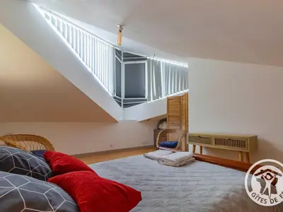Un ou plusieurs lits dans un hébergement de l'établissement Gîte charmant avec jardin au cœur du vignoble du Layon, proche Saumur, 9 couchages, vélos inclus - FR-1-622-19