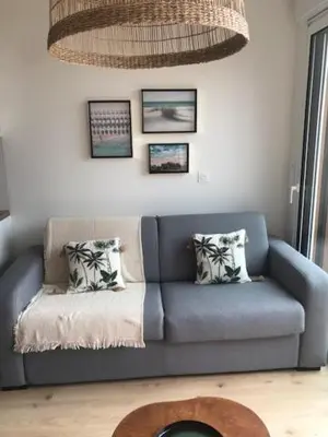 Coin salon dans l'établissement Maison de Vacances 2 personnes, ossature bois, à Saint Gilles Croix De Vie 85