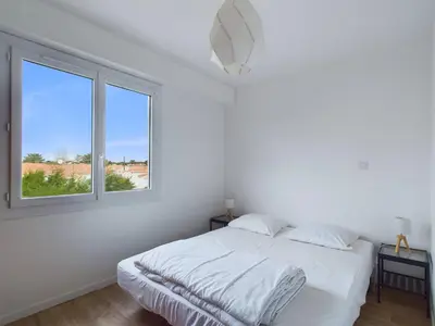Un ou plusieurs lits dans un hébergement de l'établissement À 200m de la plage, appartement pour 4