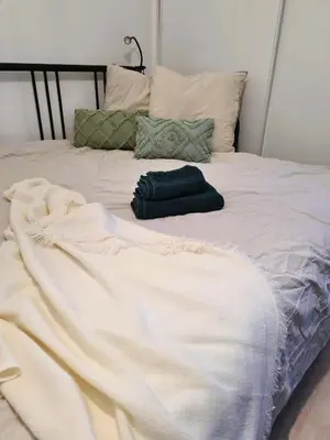 Un ou plusieurs lits dans un hébergement de l'établissement Bel appartement à 3 min de la plage de 60m²