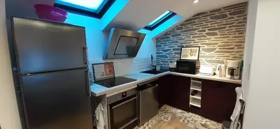 Cuisine ou kitchenette dans l'établissement Le GENISTA