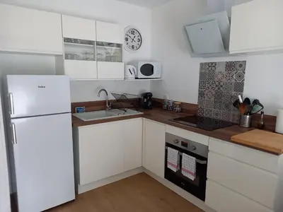 Cuisine ou kitchenette dans l'établissement Maison proche du centre ville