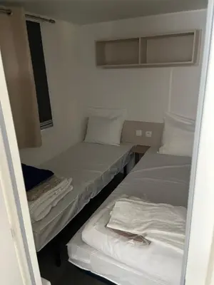 Un ou plusieurs lits dans un hébergement de l'établissement Location mobil home saison 2023