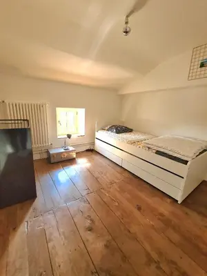 Un ou plusieurs lits dans un hébergement de l'établissement Les Hauts de St Jacques maison d'exception 300m2, jardin arboré 2000m2
