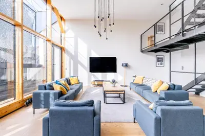 Coin salon dans l'établissement Unique à Nantes ! Loft moderne avec rooftop 10pers