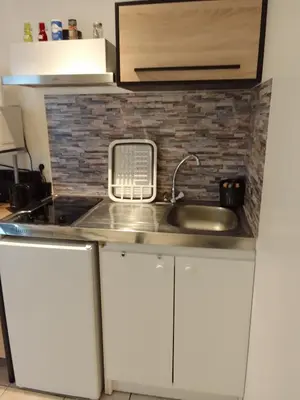 Cuisine ou kitchenette dans l'établissement chez LOLO