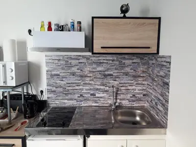 Cuisine ou kitchenette dans l'établissement chez LOLO