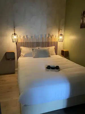 Un ou plusieurs lits dans un hébergement de l'établissement So Cosy