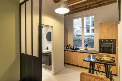 Cuisine ou kitchenette dans l'établissement La Baronne- Chaleureux T2