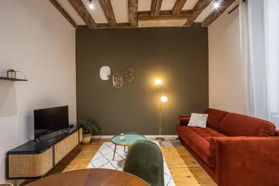 Télévision ou salle de divertissement dans l'établissement La Baronne- Chaleureux T2