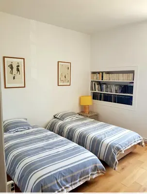 Un ou plusieurs lits dans un hébergement de l'établissement Bel appartement à la Chetardière