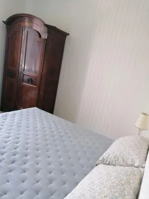 Un ou plusieurs lits dans un hébergement de l'établissement Maison de vacances vue mer