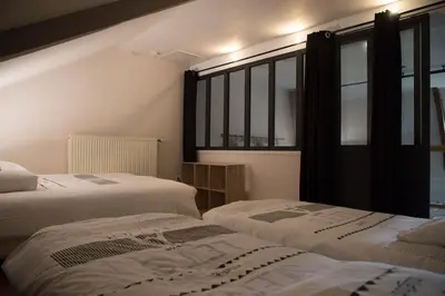 Un ou plusieurs lits dans un hébergement de l'établissement Gîte de charme à la campagne