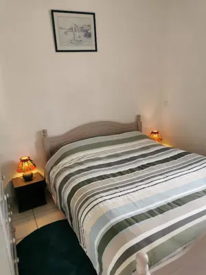 Un ou plusieurs lits dans un hébergement de l'établissement Le Cosy d'Eden