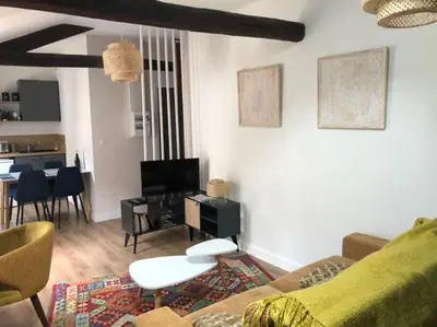 Télévision ou salle de divertissement dans l'établissement Appartement en cœur de ville