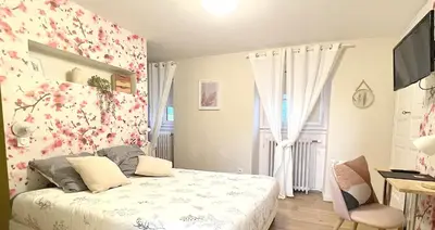 Un ou plusieurs lits dans un hébergement de l'établissement Chambre Crémant - Maison Bossoreil