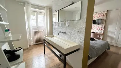 Un ou plusieurs lits dans un hébergement de l'établissement Chambre Crémant - Maison Bossoreil