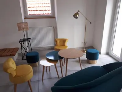 Coin salon dans l'établissement Les Palmiers. Charme, spa et massage en vignoble nantais