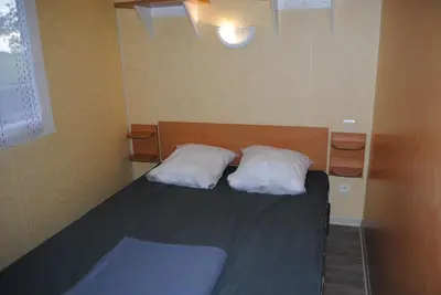 Un ou plusieurs lits dans un hébergement de l'établissement Mobil Home camping 3*** piscine chauffée