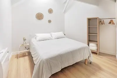 Un ou plusieurs lits dans un hébergement de l'établissement La Galerie Pornic - Maison Lotus