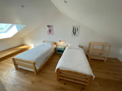 Un ou plusieurs lits dans un hébergement de l'établissement Maisonnette confortable à Pornic