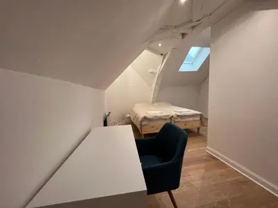 Un ou plusieurs lits dans un hébergement de l'établissement Le cottage de l’Oudon