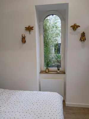 Un ou plusieurs lits dans un hébergement de l'établissement Maison indépendante cosy avec terrasse privée - La Laiterie