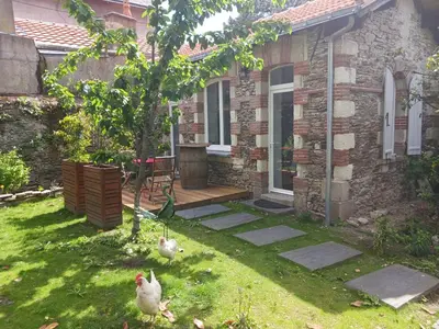 Jardin de l'établissement Maison indépendante cosy avec terrasse privée - La Laiterie