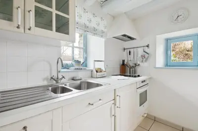 Cuisine ou kitchenette dans l'établissement Gite Bleu