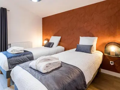 Un ou plusieurs lits dans un hébergement de l'établissement Grande grange rénovée avec jardin et spa proche de Nantes - FR-1-306-1234
