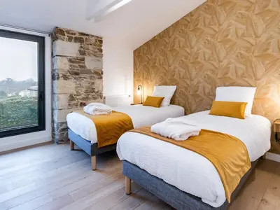 Un ou plusieurs lits dans un hébergement de l'établissement Grande grange rénovée avec jardin et spa proche de Nantes - FR-1-306-1234