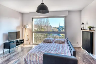 Un ou plusieurs lits dans un hébergement de l'établissement Bourgonnier 19 - Charmant studio à Angers