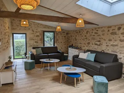 Coin salon dans l'établissement Maison de Vacances 12min du Puy du fou grand studio