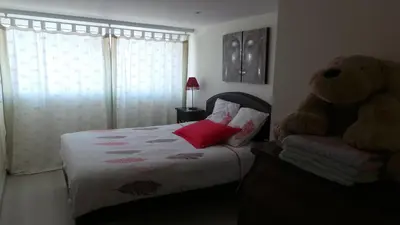 Un ou plusieurs lits dans un hébergement de l'établissement La petite Logne - logement avec piscine