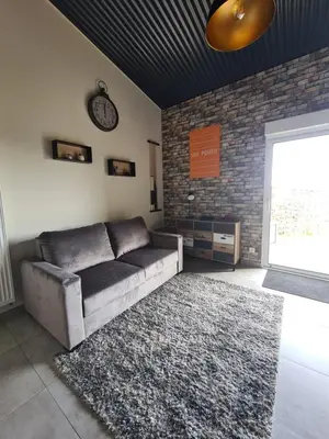 Coin salon dans l'établissement Gîte La Dortière s'Amuse, magnifique maison de maître 12min du Puy du Fo