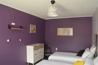 Un ou plusieurs lits dans un hébergement de l'établissement Gîte La Dortière s'Amuse, magnifique maison de maître 12min du Puy du Fo