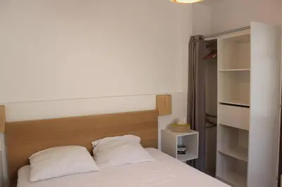 Un ou plusieurs lits dans un hébergement de l'établissement Maisonnette 2 pièces 100m de la plage de la Clère