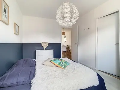 Un ou plusieurs lits dans un hébergement de l'établissement Maison cosy au calme parking privé inclus