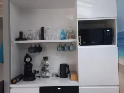 Cuisine ou kitchenette dans l'établissement Charmante maison avec spa, sauna et jardin privatif